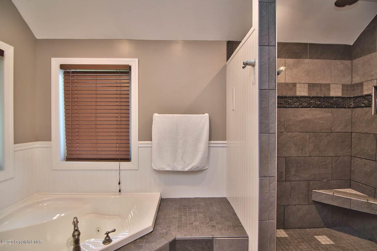 659 Behrens Road Jim Thorpe, PA 18229 - Photo 46 of 116 a bathroom with a bathtub and a shower