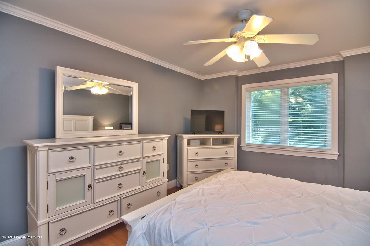 659 Behrens Road Jim Thorpe, PA 18229 - Photo 60 of 116 a bedroom with a bed and a flat tv screen on dresser
