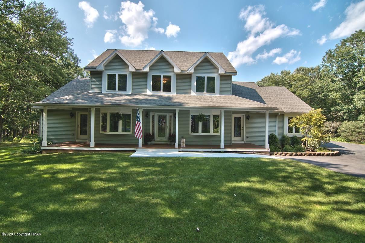 659 Behrens Road Jim Thorpe, PA 18229 - Photo 6 of 116 a front view of a house with a garden