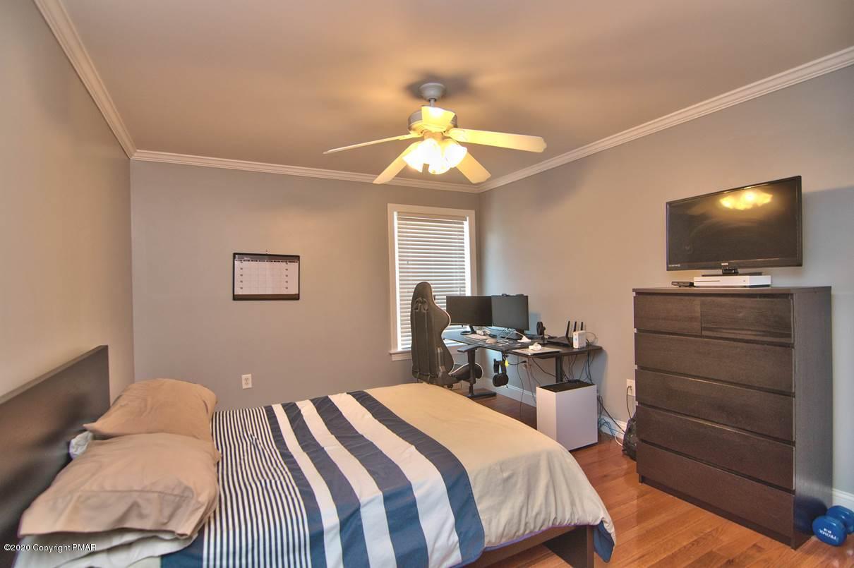 659 Behrens Road Jim Thorpe, PA 18229 - Photo 63 of 116 a bedroom with a bed and a flat screen tv