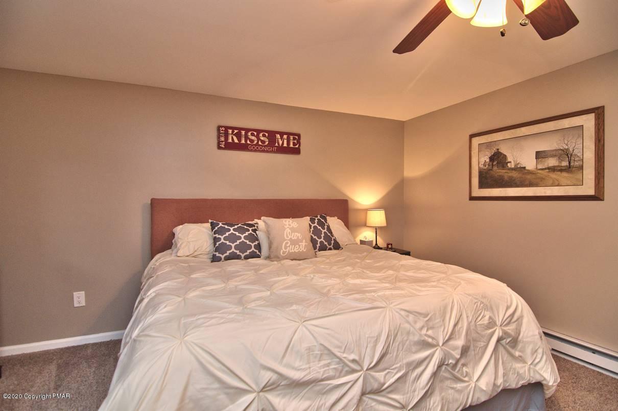 659 Behrens Road Jim Thorpe, PA 18229 - Photo 68 of 116 a large bed sitting in a bedroom next to a lamp