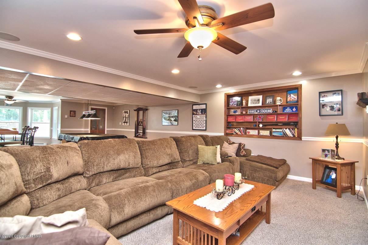 659 Behrens Road Jim Thorpe, PA 18229 - Photo 77 of 116 a living room with furniture kitchen view and a chandelier