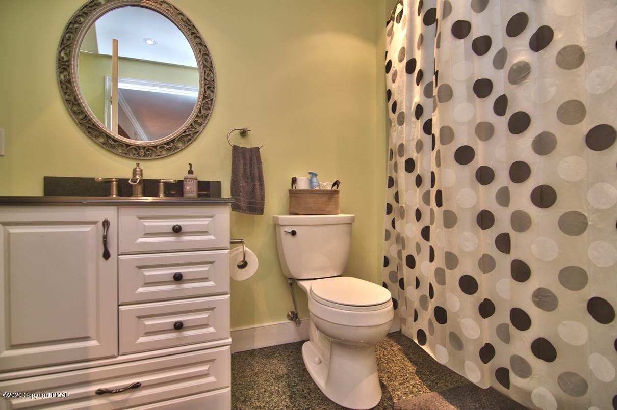 659 Behrens Road Jim Thorpe, PA 18229 - Photo 82 of 116 a bathroom with a toilet a sink and a mirror