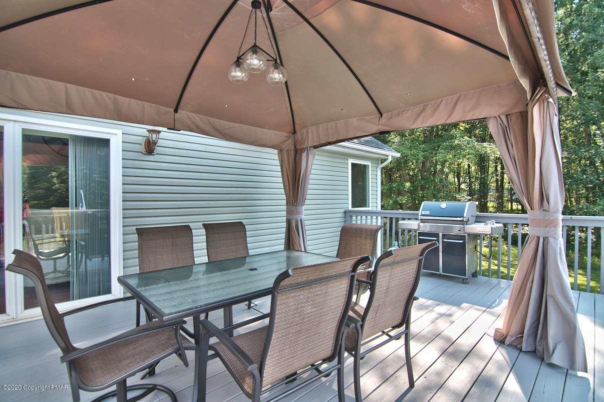 659 Behrens Road Jim Thorpe, PA 18229 - Photo 83 of 116 a view of a patio with a dining table and chairs