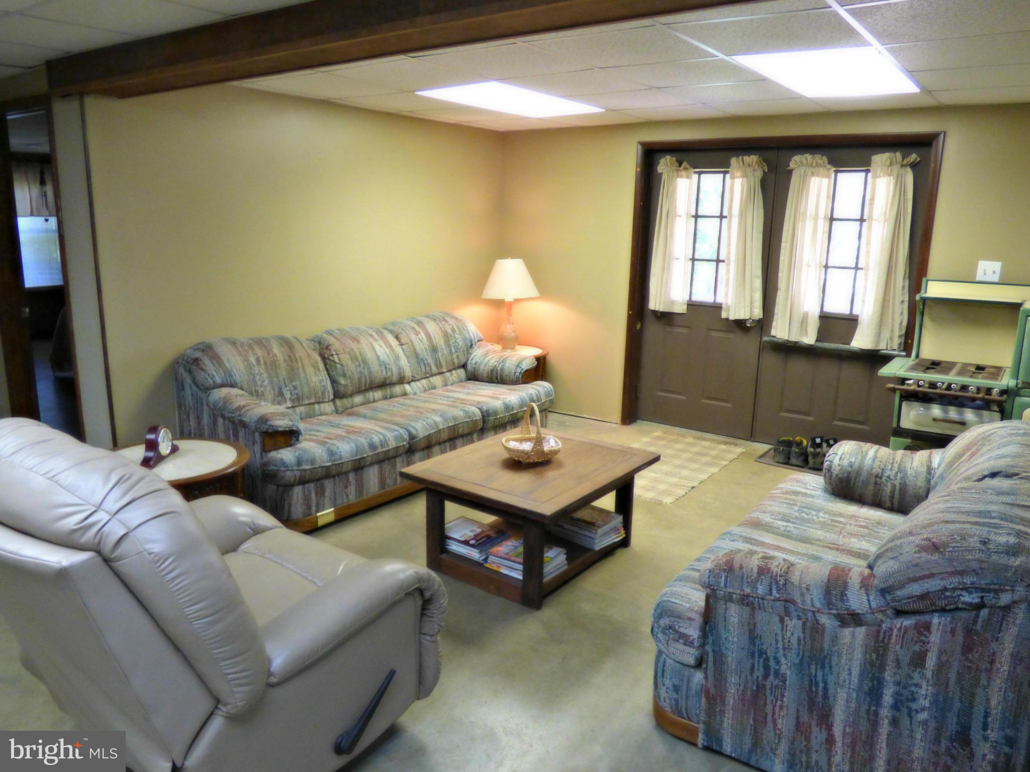 8409 Mapleville Road Mount Airy, MD 21771 - Photo 25 of 30 a living room with furniture and a window