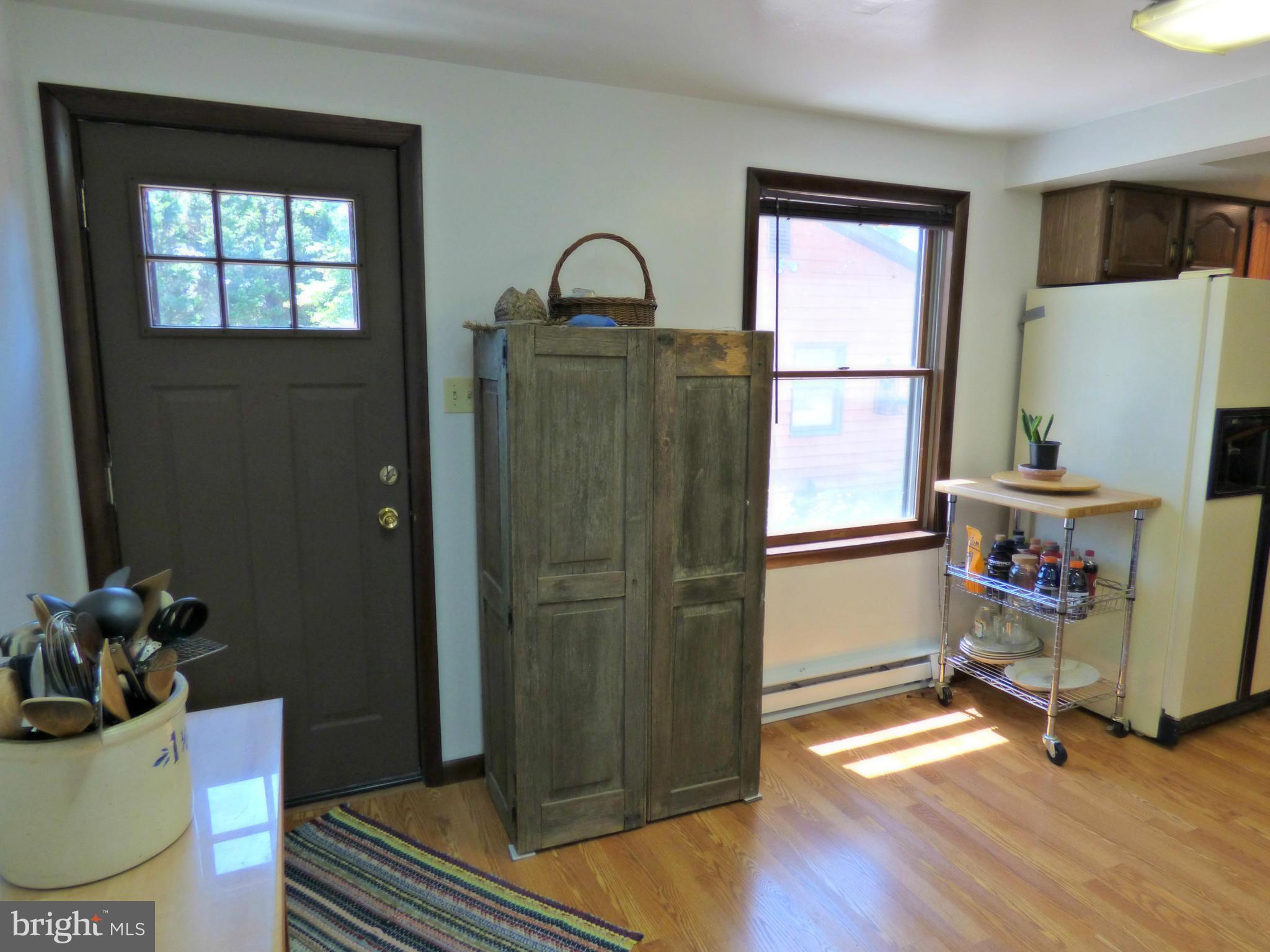 8409 Mapleville Road Mount Airy, MD 21771 - Photo 28 of 30 a room with a window and wooden floor