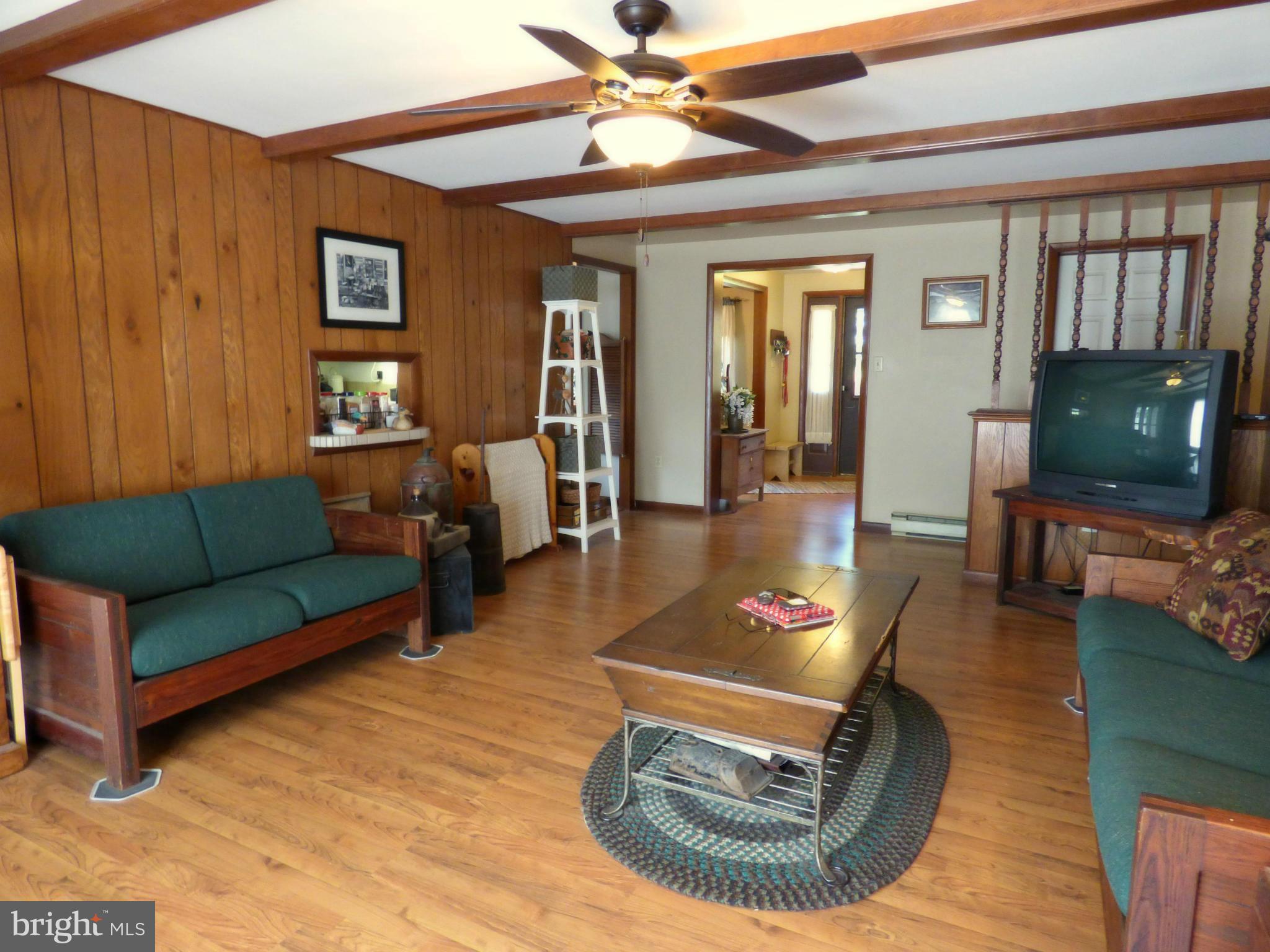 8409 Mapleville Road Mount Airy, MD 21771 - Photo 5 of 30 a living room with furniture and a flat screen tv