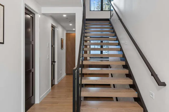 a view of entryway and hall with wooden floor