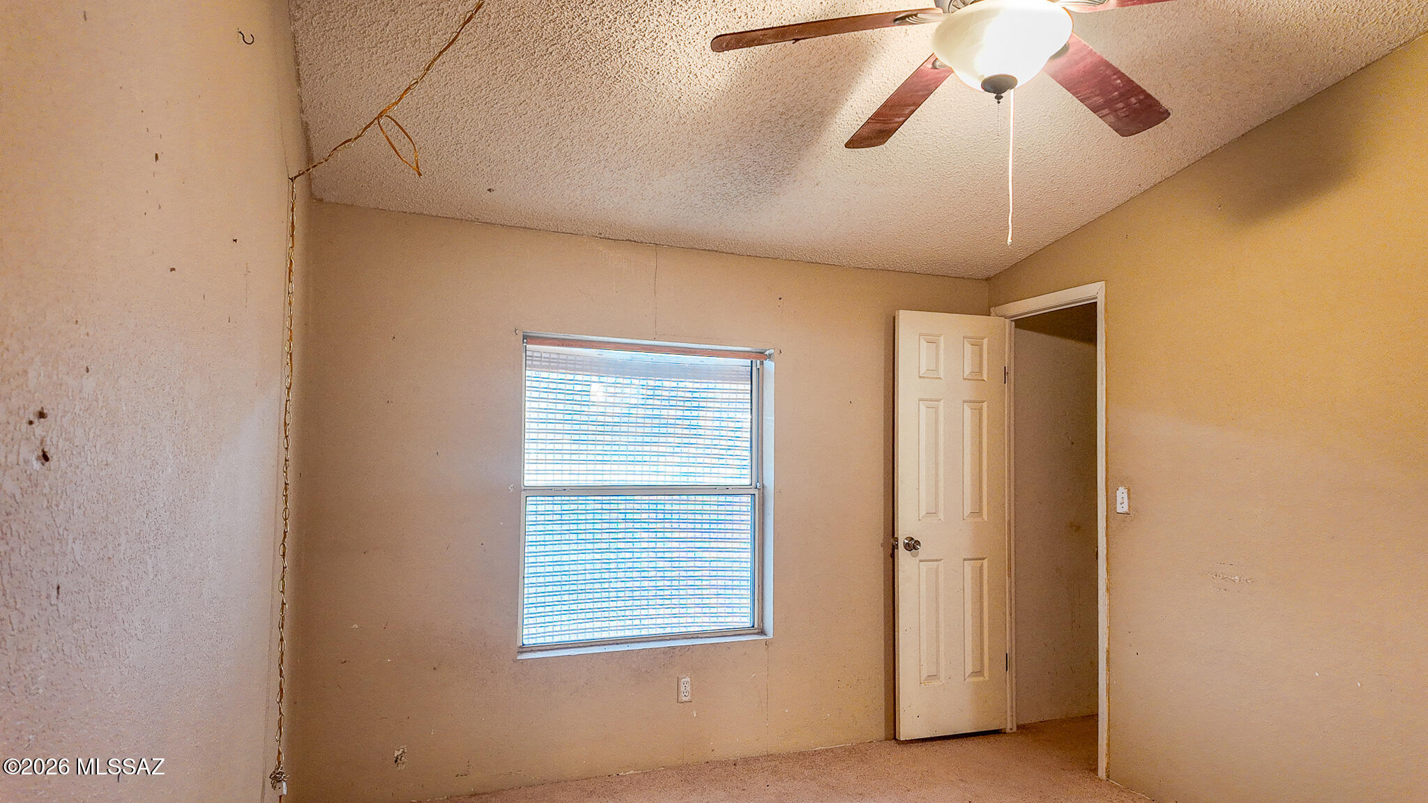 27651 South Canoa Road Amado, AZ 85645 - Photo 16 of 20 a view of a livingroom with a chandelier fan