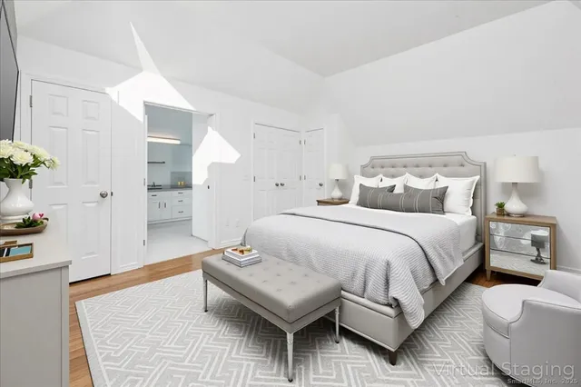 a spacious bedroom with a bed and a couch