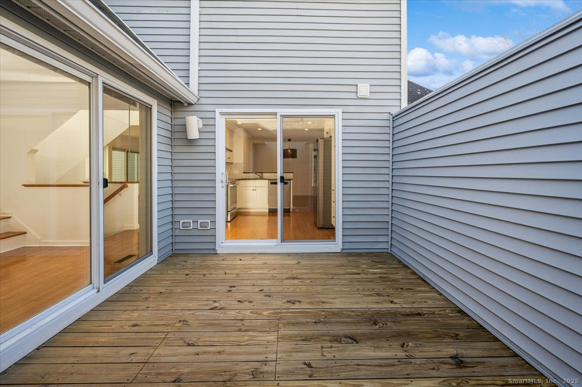 66 Wilton Crest Road, Unit 66 Wilton, CT 06897 - Photo 14 of 25 a view of a porch with wooden floor