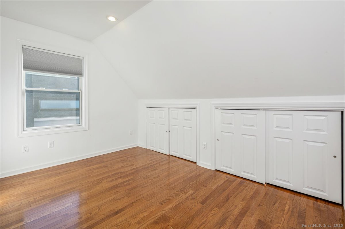66 Wilton Crest Road, Unit 66 Wilton, CT 06897 - Photo 18 of 25 wooden floor in an empty room