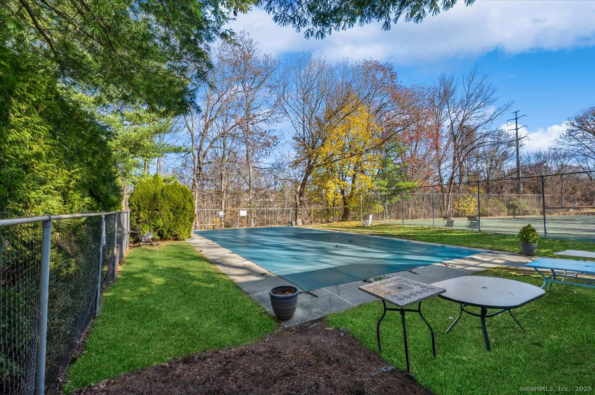 66 Wilton Crest Road, Unit 66 Wilton, CT 06897 - Photo 23 of 25 a view of a backyard