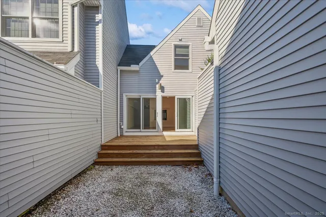 a view of a house with a yard and a large window
