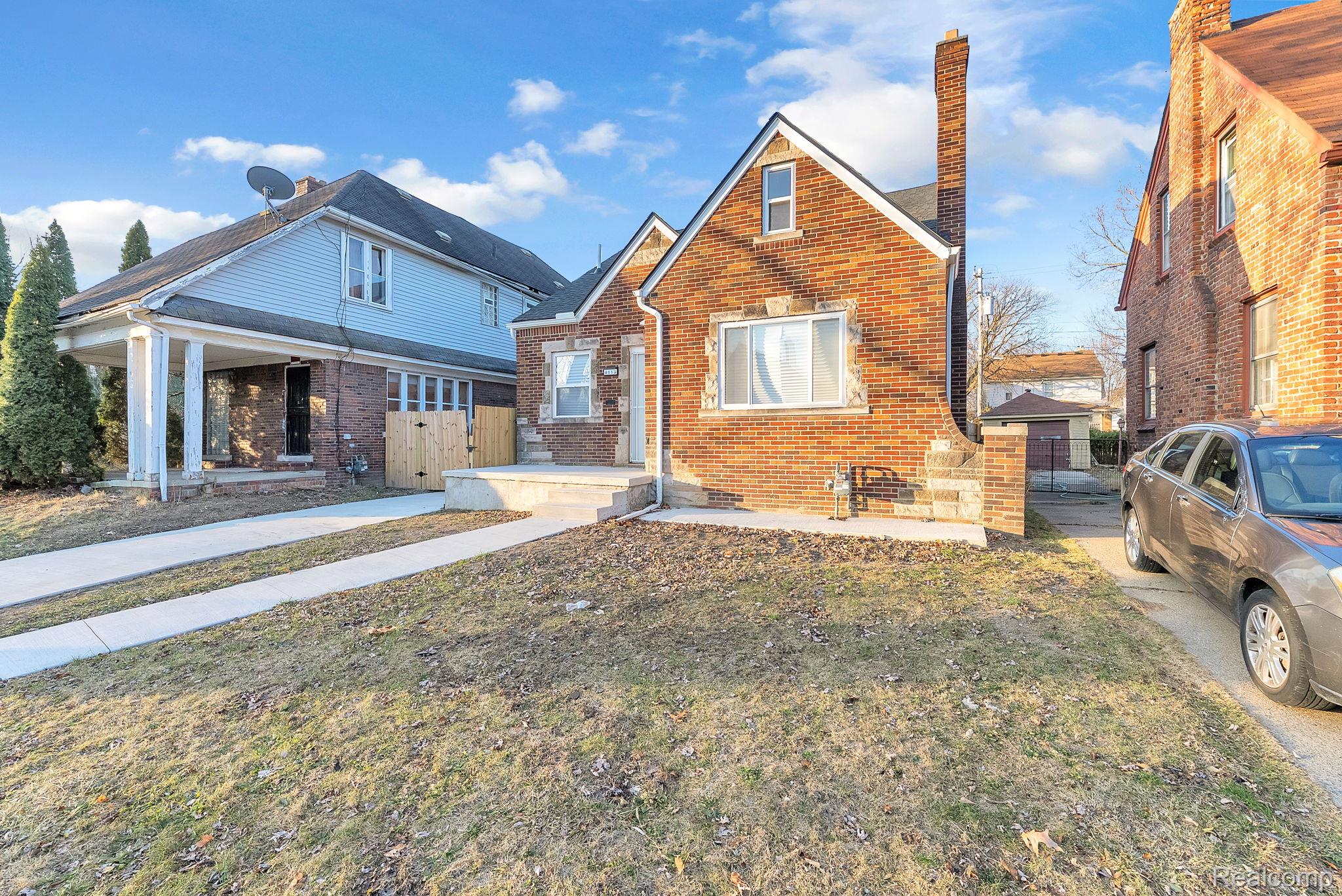 4113 Devonshire Road Detroit, MI 48224 - Photo 3 of 36 View of front of house with brick siding, a chimney, and a gate