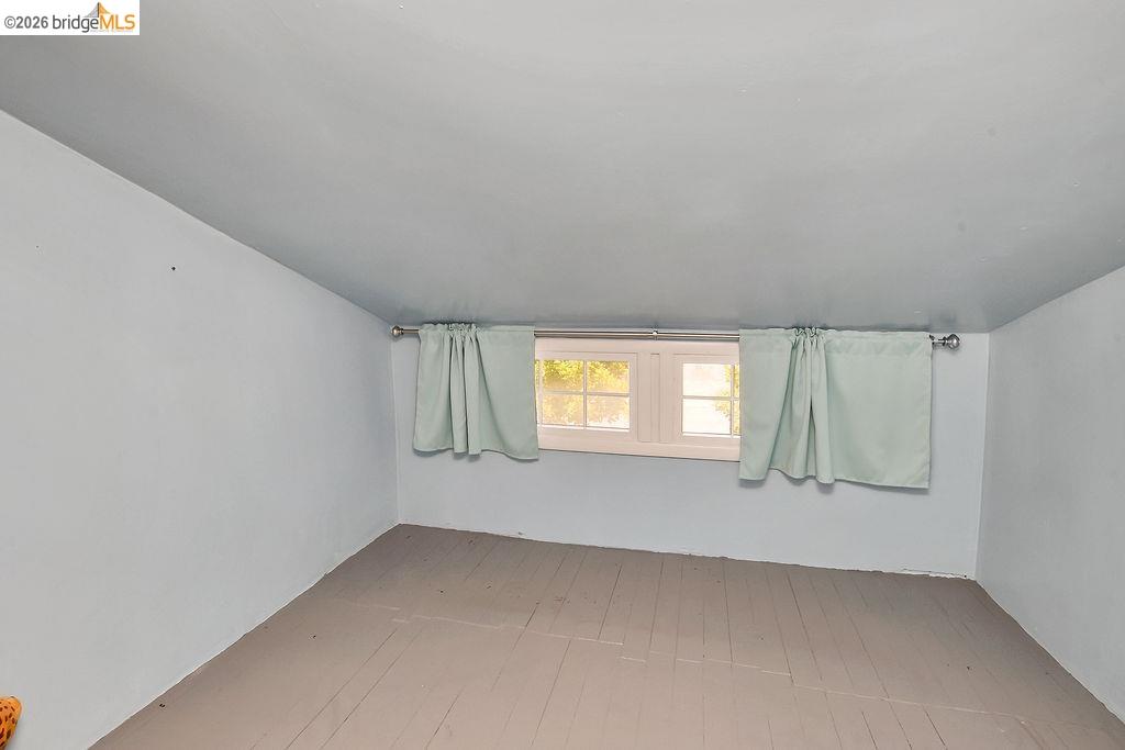 325 South 2nd Street Rio Vista, CA 94571 - Photo 31 of 33 Room featuring a single-pane window with white trim, a curtain rod, and light-colored walls