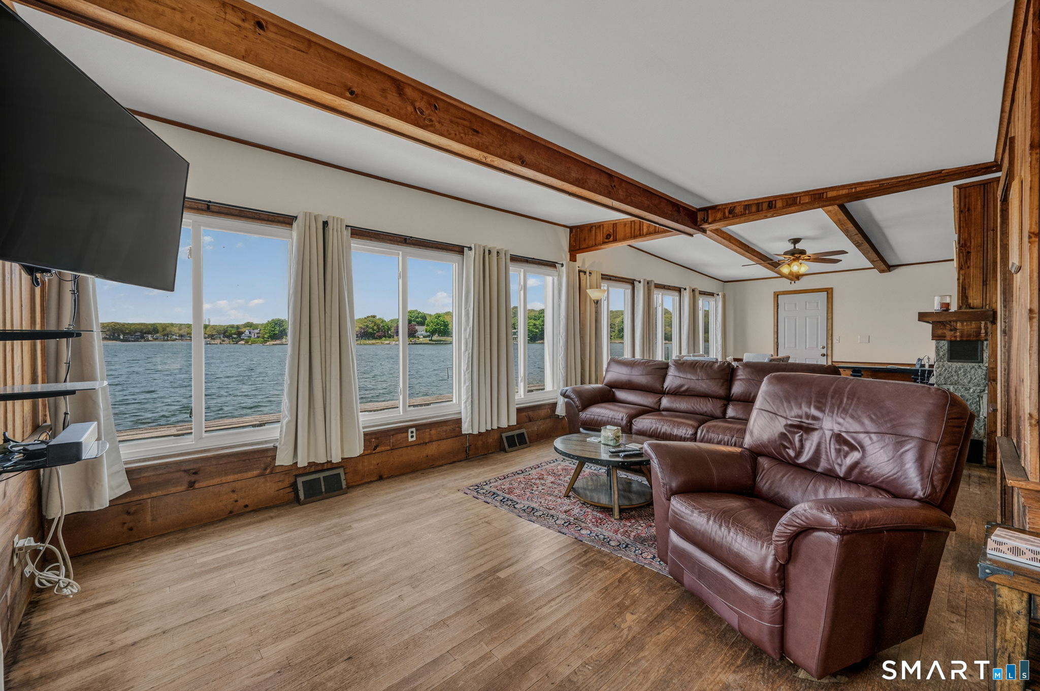 210 Shore Road Waterford, CT 06385 - Photo 16 of 26 a living room with furniture and a large window