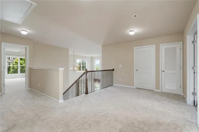 a view of an empty room with stairs