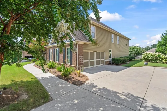 a front view of a house with garden