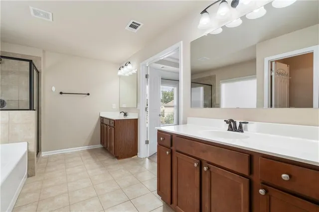 a bathroom with a sink a vanity and a mirror