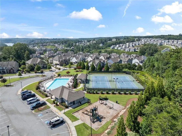 an aerial view of a house with outdoor space swimming pool patio and outdoor seating