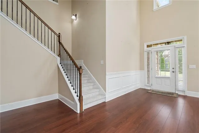 a view of an entryway with wooden floor