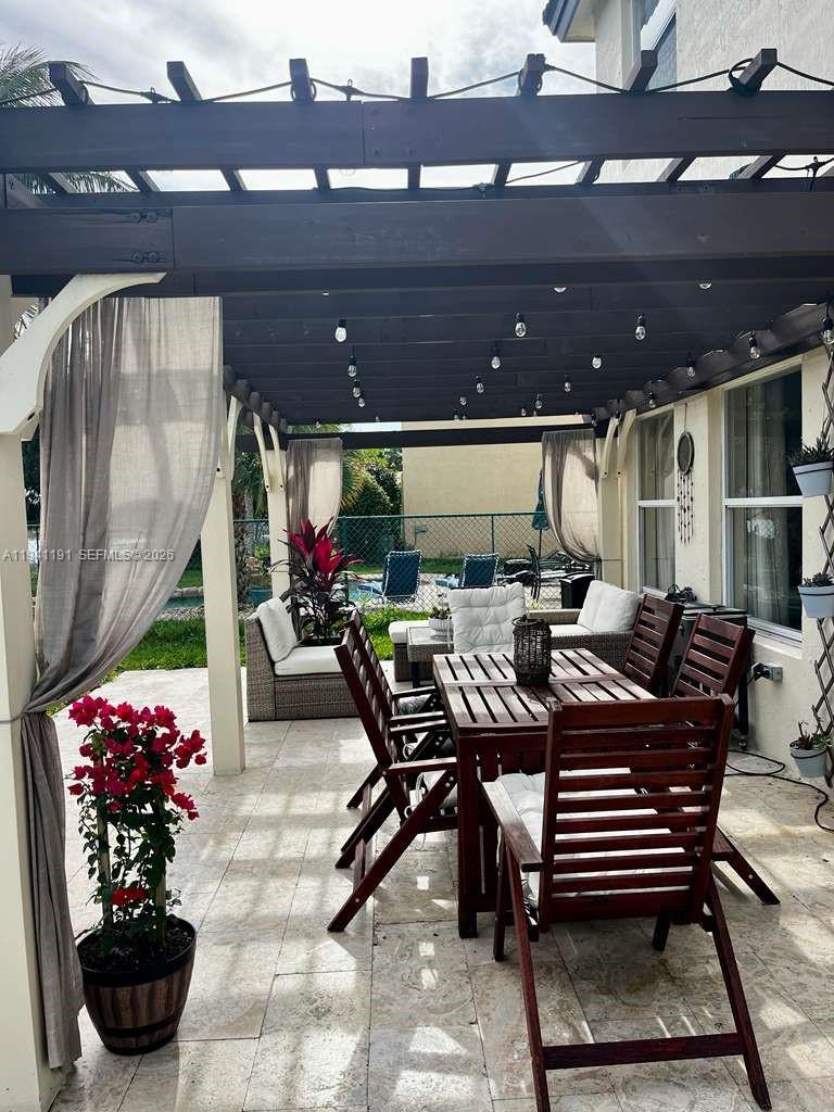 1531 Southeast 20th Road Homestead, FL 33035 - Photo 9 of 10 a outdoor dining space with furniture and a potted plant