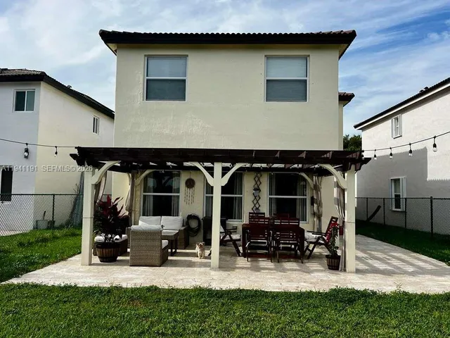 a front view of house with outdoor seating