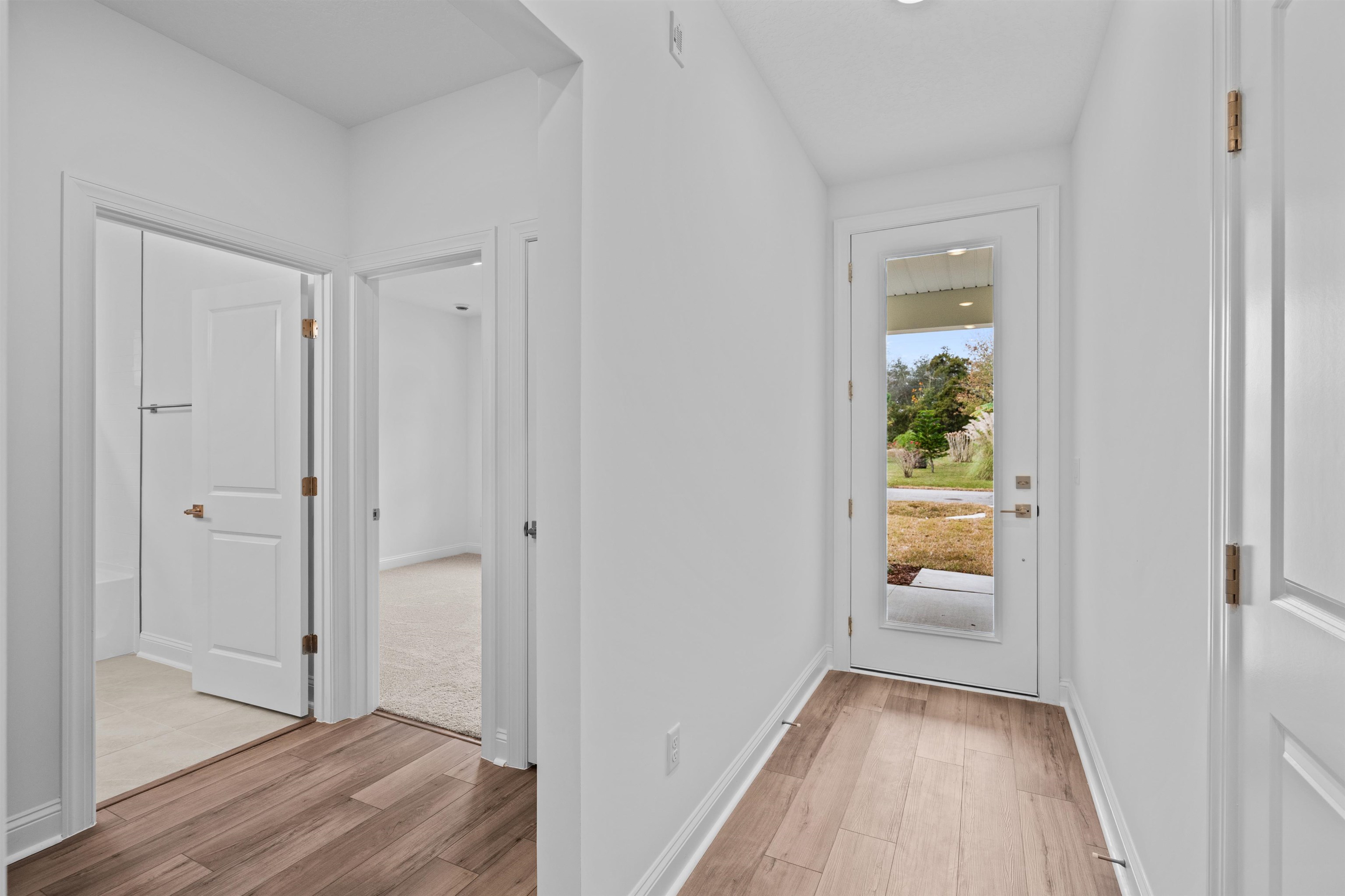 108 Aspen Road St. Augustine, FL 32086 - Photo 4 of 24 Hallway featuring light wood finished floors and baseboards