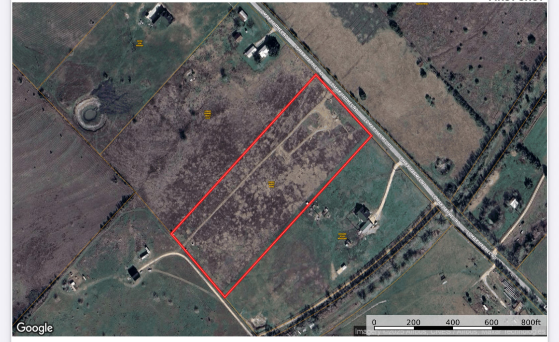 Aerial map of property and surrounding area featuring property boundaries highlighted