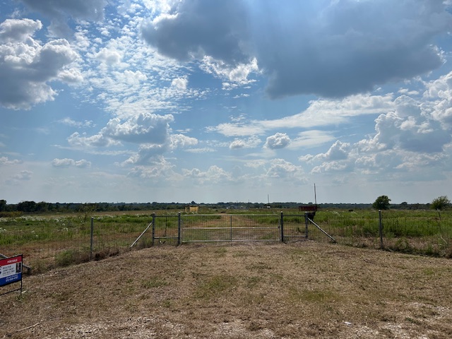 1079 Lomax Harmel Road Burton, TX 77835 - Photo 8 of 12 View of yard featuring a view of countryside and a gate