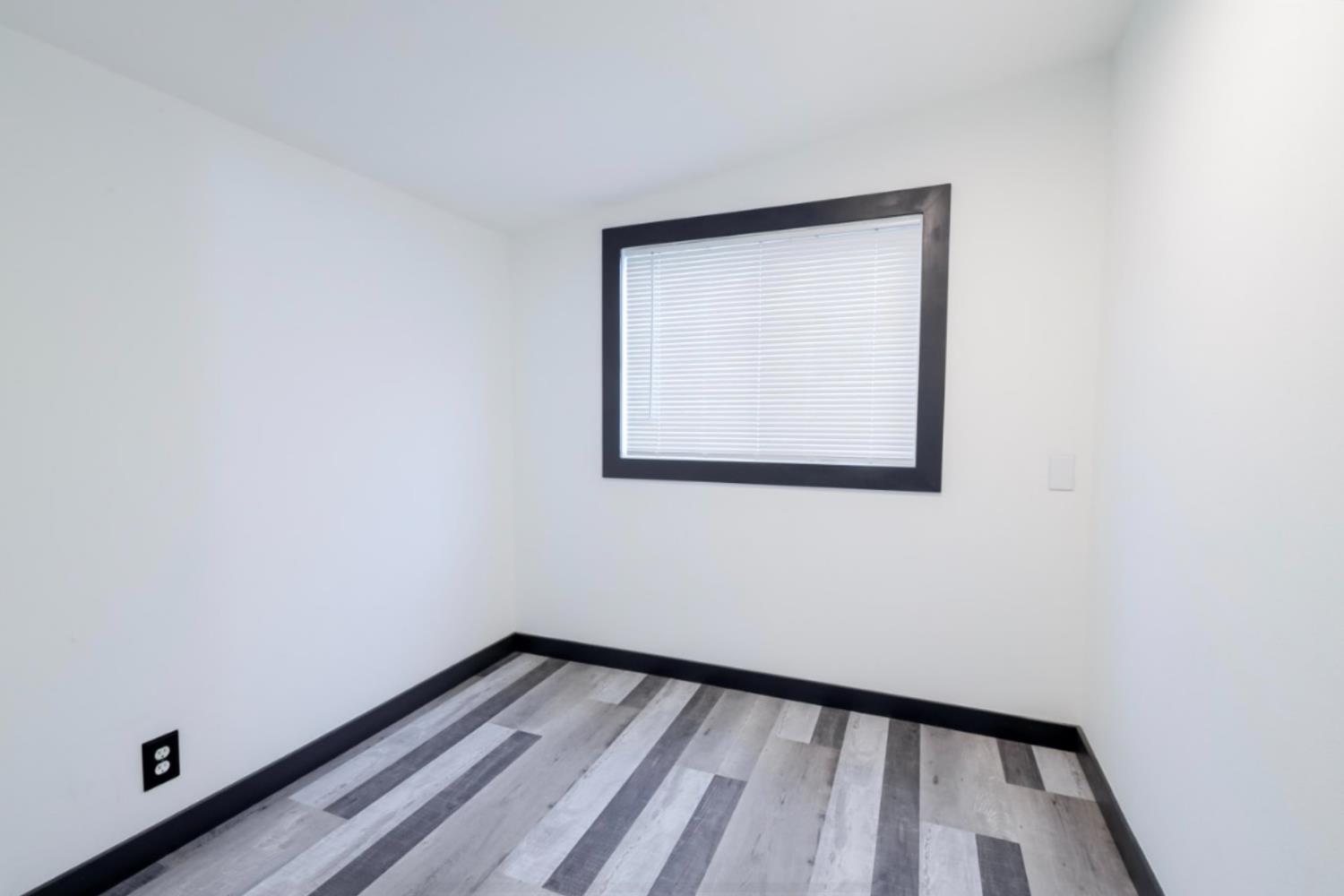 2331 Downar Way Sacramento, CA 95838 - Photo 11 of 23 a view of a small space with wooden floor and a window