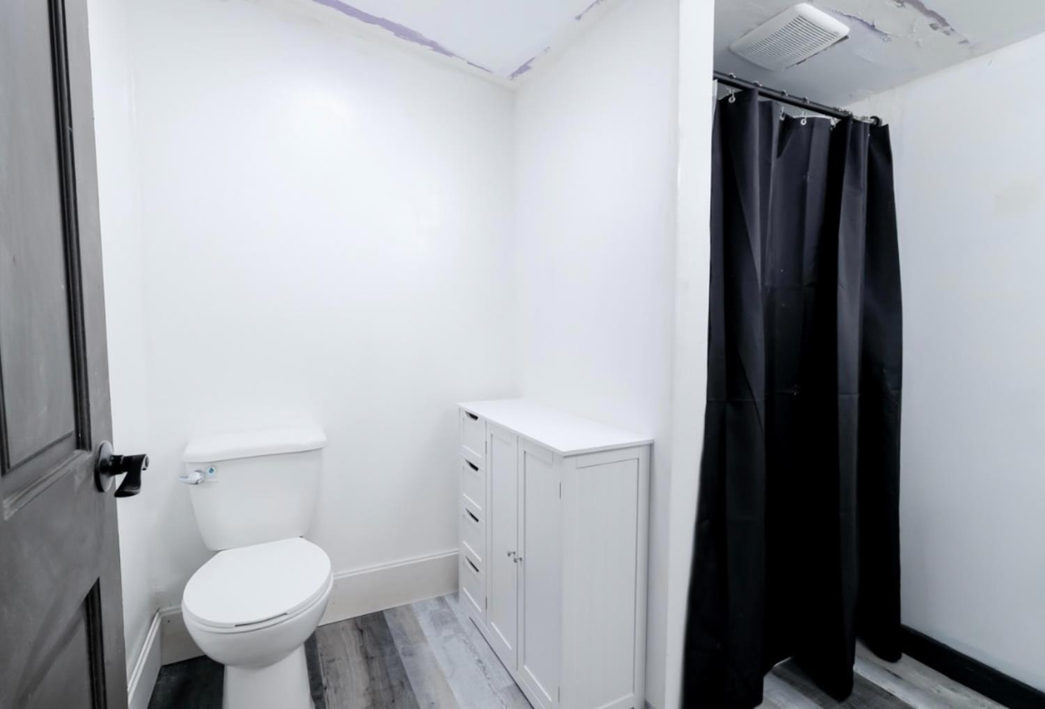 2331 Downar Way Sacramento, CA 95838 - Photo 14 of 23 a bathroom with a toilet and a shower