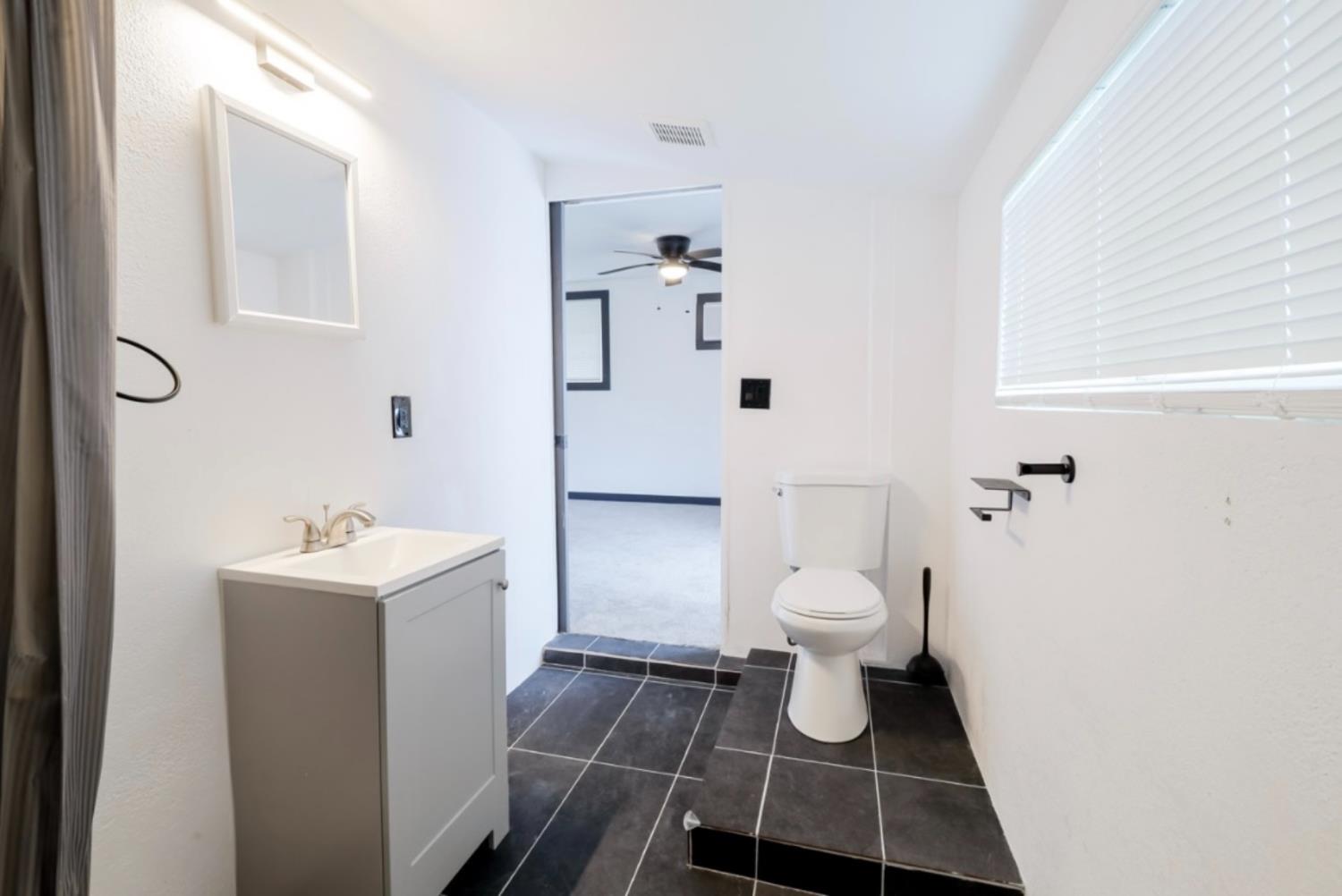 2331 Downar Way Sacramento, CA 95838 - Photo 20 of 23 a bathroom with a sink toilet and shower