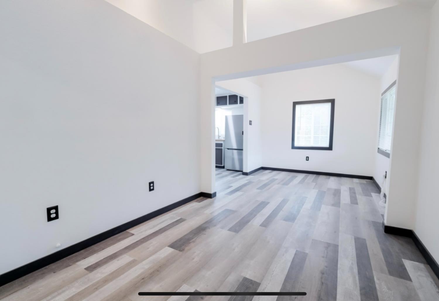 2331 Downar Way Sacramento, CA 95838 - Photo 4 of 23 a view of an empty room and wooden floor