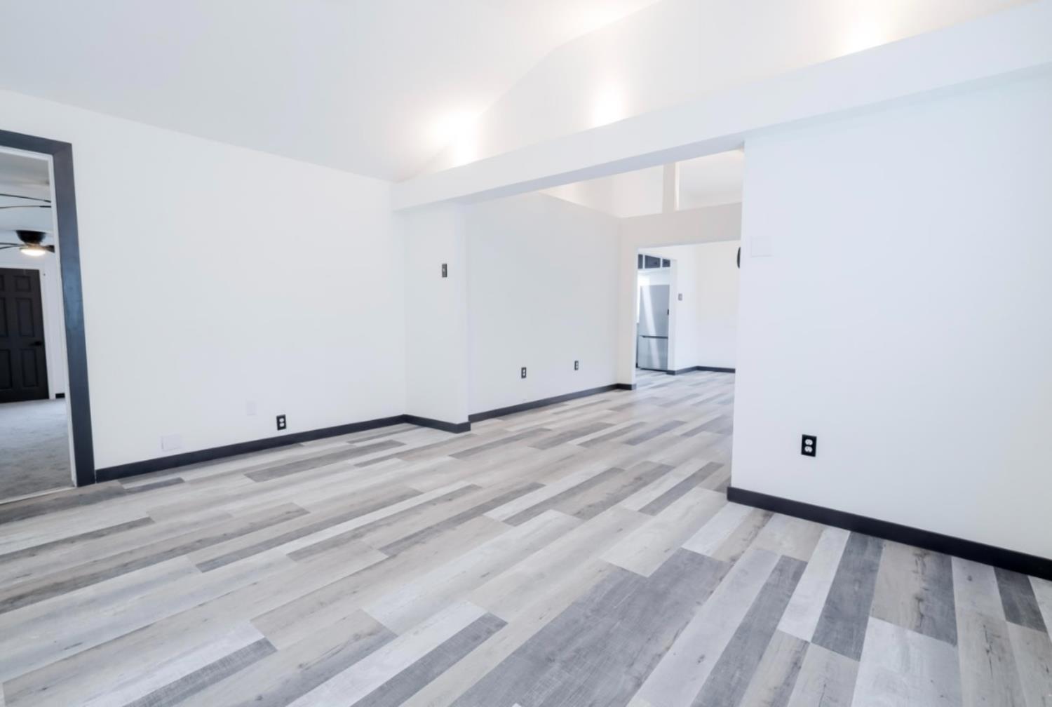 2331 Downar Way Sacramento, CA 95838 - Photo 6 of 23 a view of empty room with wooden floor