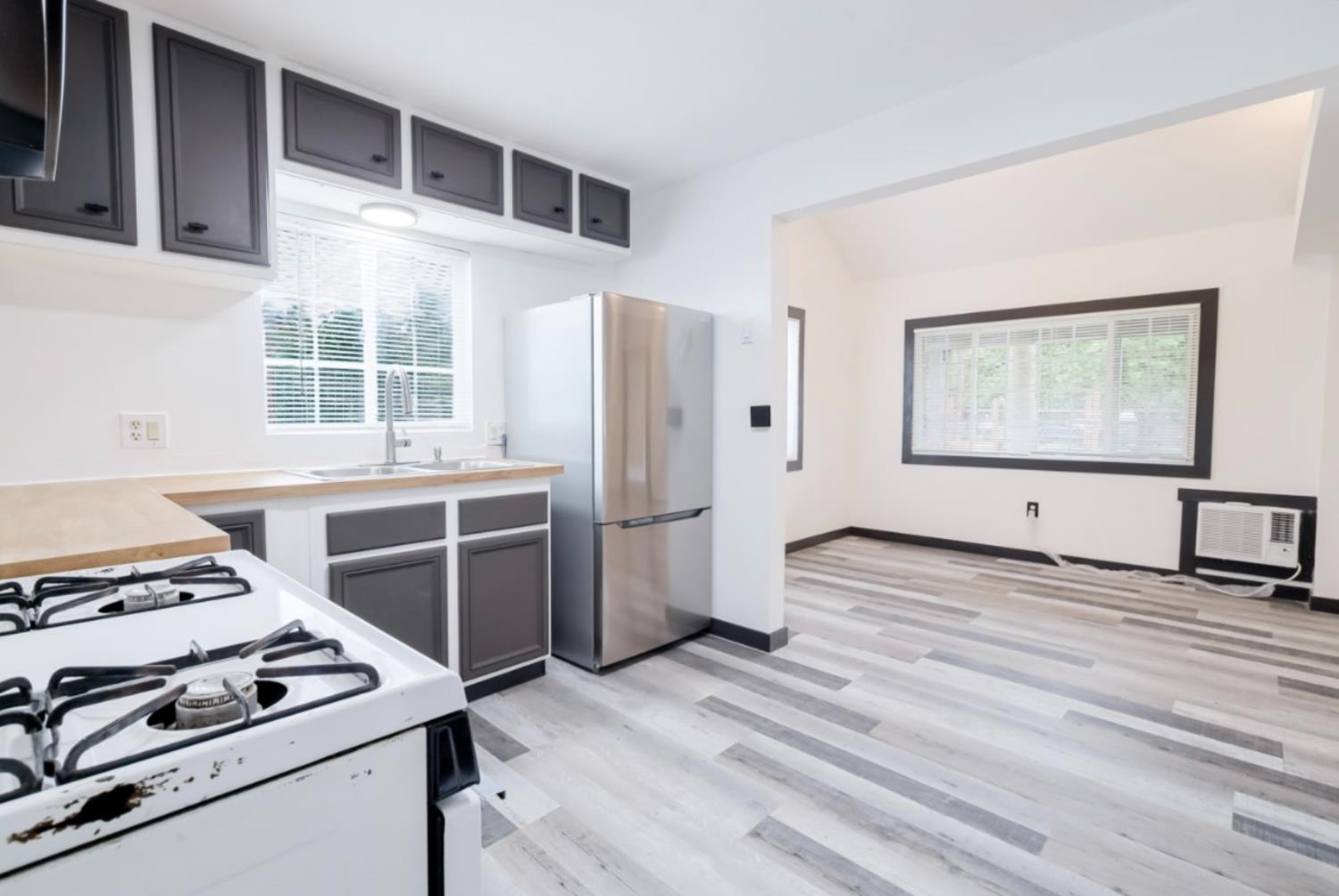 2331 Downar Way Sacramento, CA 95838 - Photo 9 of 23 a kitchen with a stove and a refrigerator