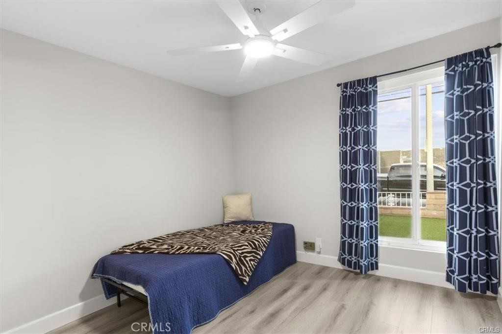 1353 Termino Avenue Long Beach, CA 90804 - Photo 19 of 30 a bedroom with a bed and a window