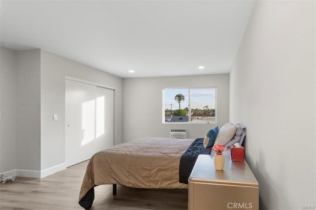 1353 Termino Avenue Long Beach, CA 90804 - Photo 26 of 30 a bedroom with a bed and a window
