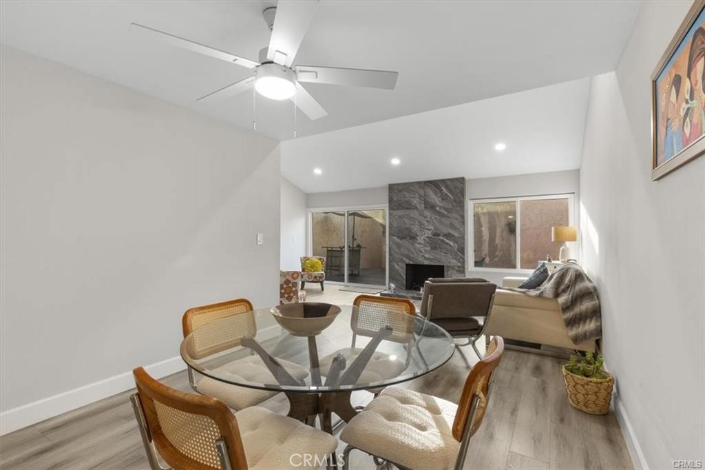 1353 Termino Avenue Long Beach, CA 90804 - Photo 4 of 30 a dining room with furniture and a chandelier fan