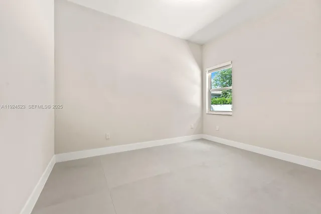a bedroom with furniture and flat screen tv