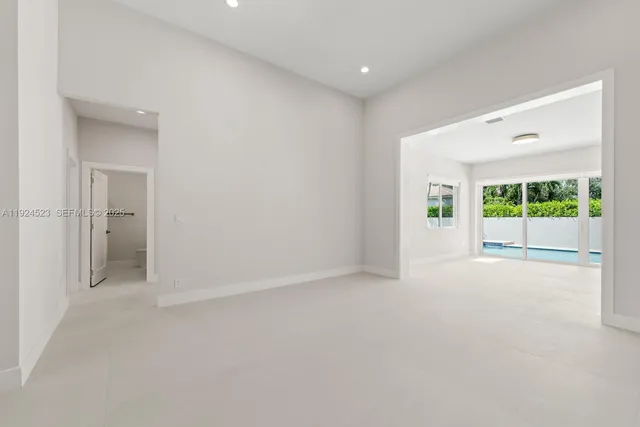 a kitchen with white cabinets
