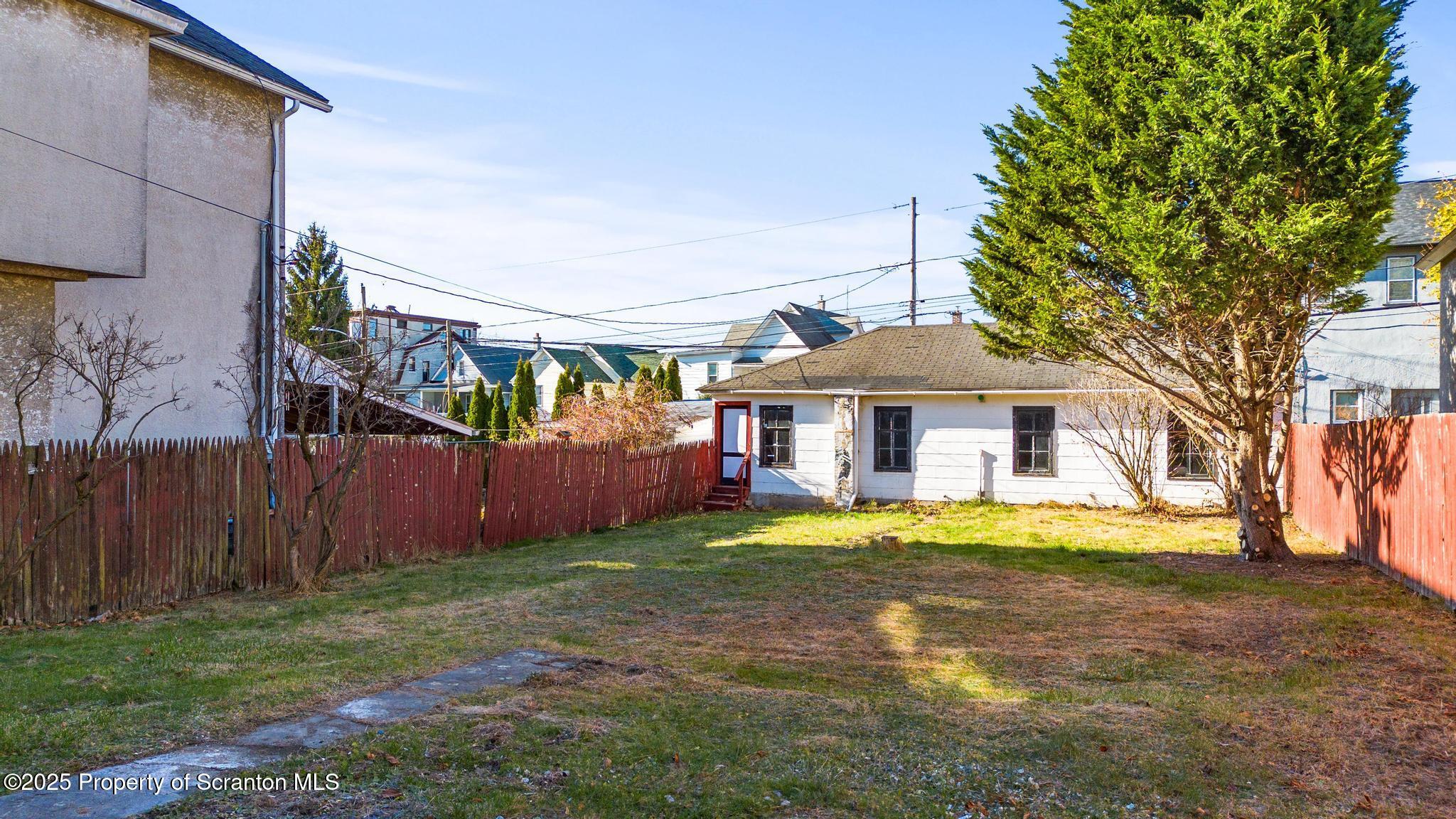 949 Taylor Avenue Scranton, PA 18510 - Photo 13 of 46 a view of a house with a yard