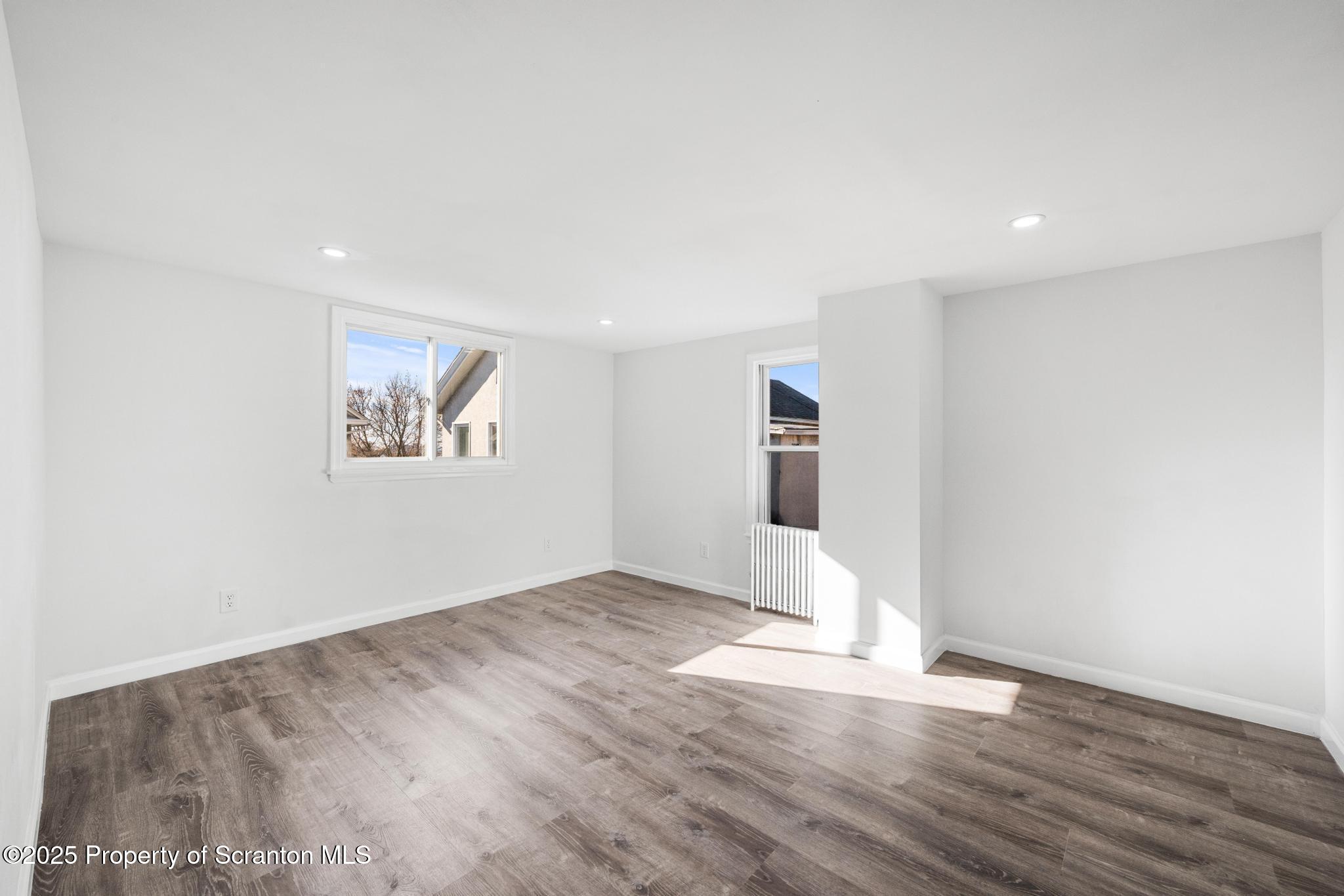 949 Taylor Avenue Scranton, PA 18510 - Photo 15 of 46 a view of empty room with wooden floor