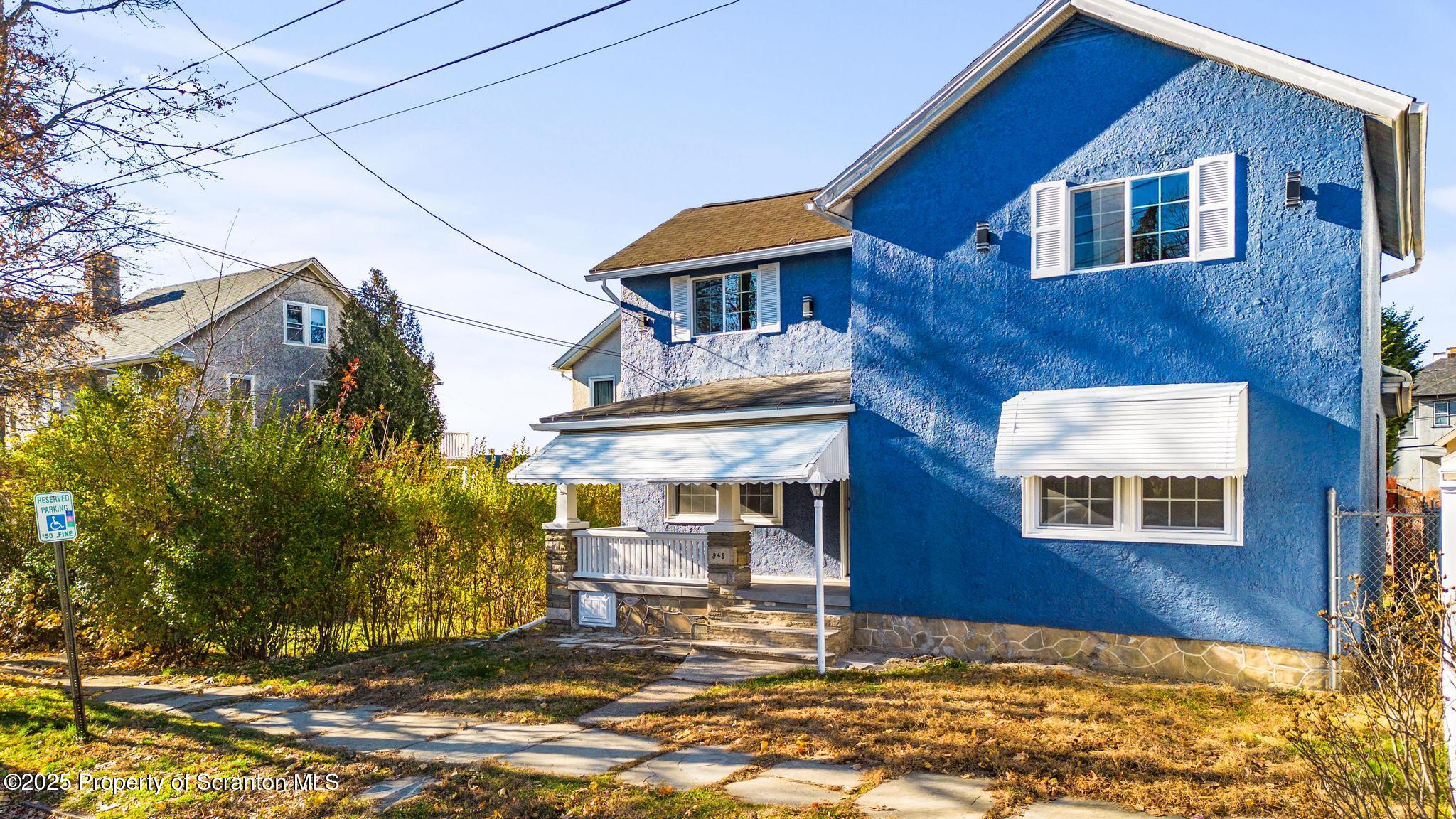 949 Taylor Avenue Scranton, PA 18510 - Photo 2 of 46 a front view of a house with a yard