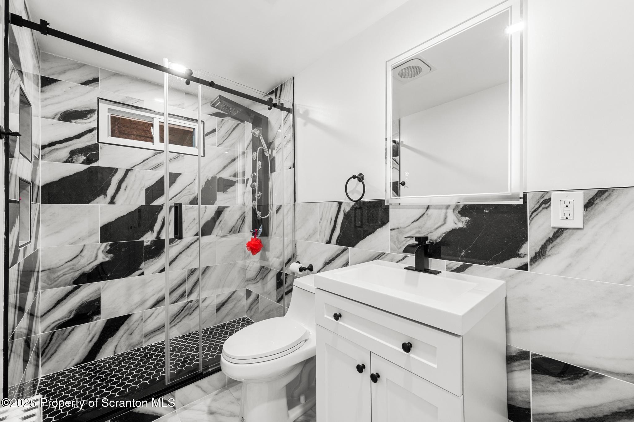 949 Taylor Avenue Scranton, PA 18510 - Photo 25 of 46 a bathroom with a sink toilet and shower