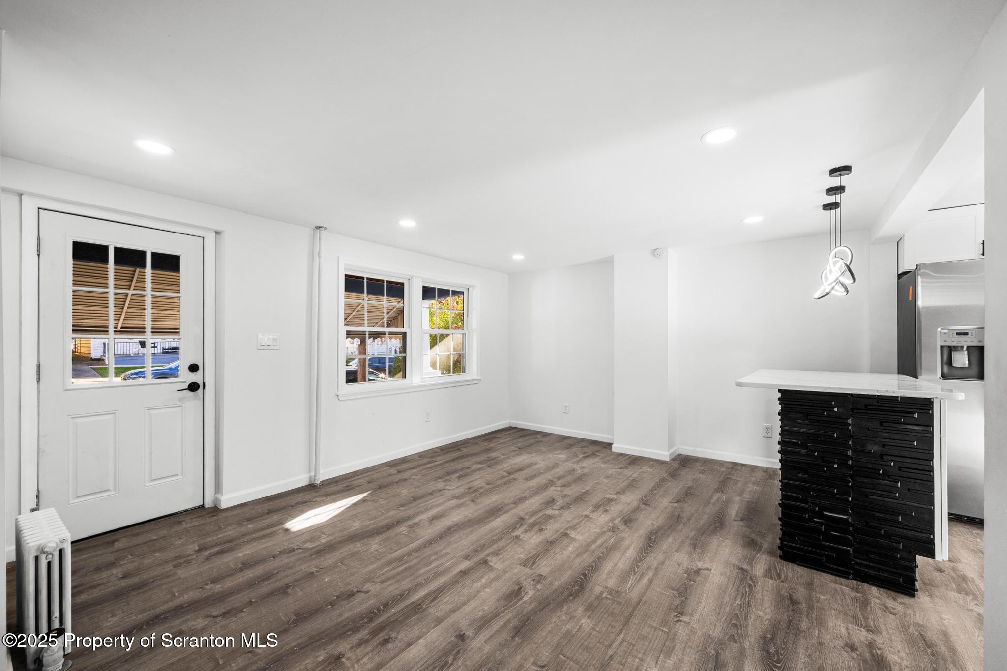 949 Taylor Avenue Scranton, PA 18510 - Photo 30 of 46 wooden floor in an empty room with a fireplace