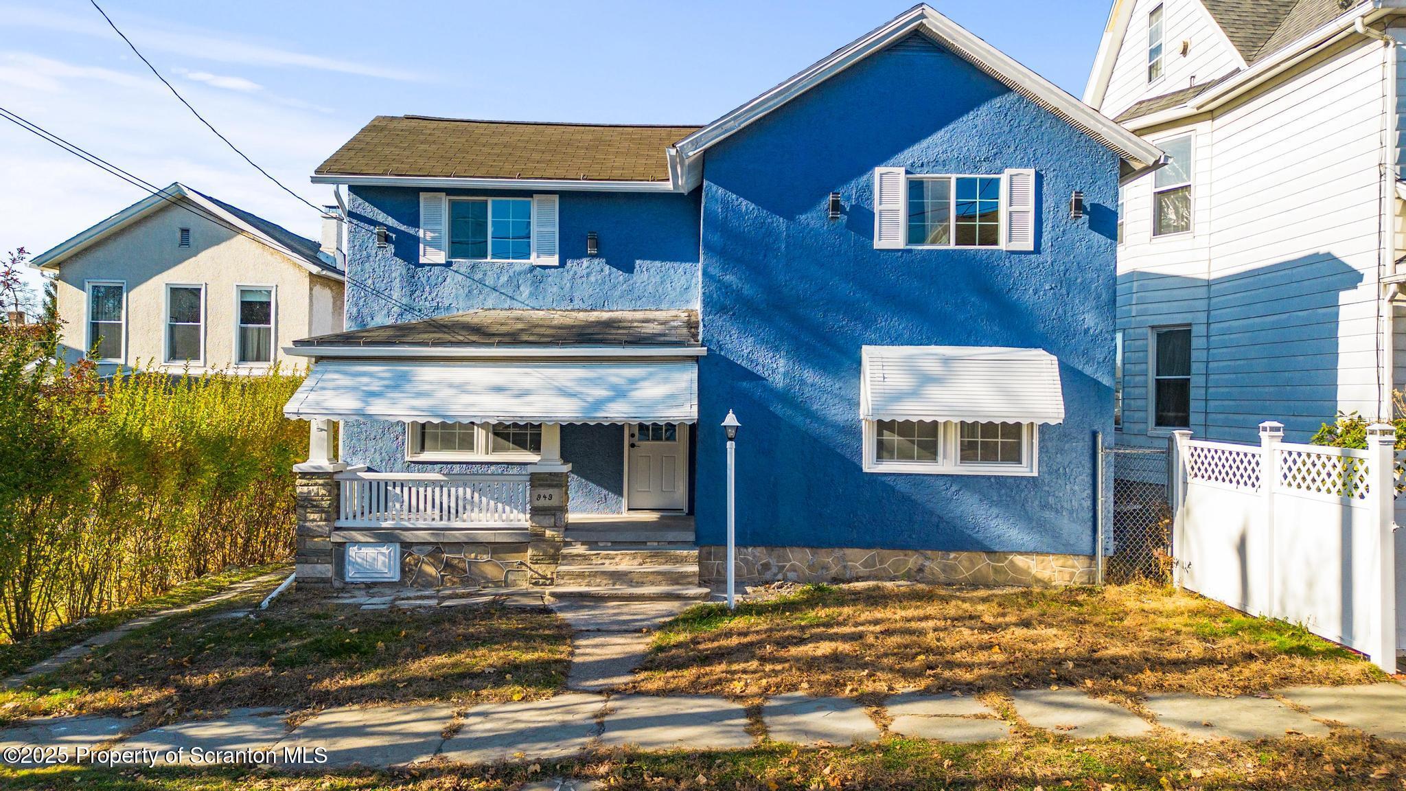 949 Taylor Avenue Scranton, PA 18510 - Photo 3 of 46 a front view of a house with a yard