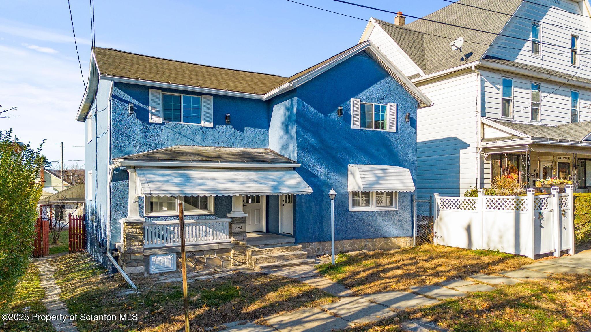 949 Taylor Avenue Scranton, PA 18510 - Photo 4 of 46 a front view of a house with a yard
