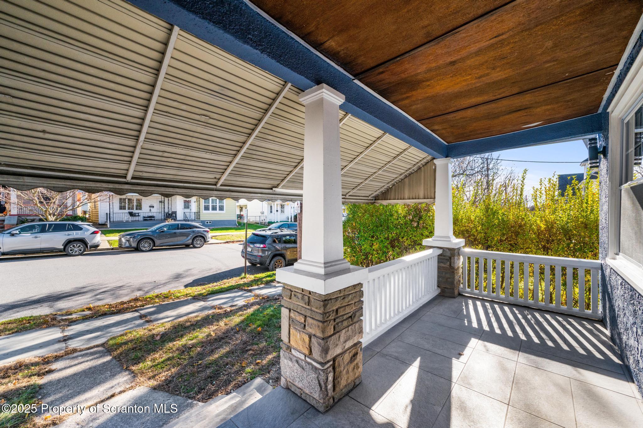 949 Taylor Avenue Scranton, PA 18510 - Photo 41 of 46 a front view of a house with garden and patio